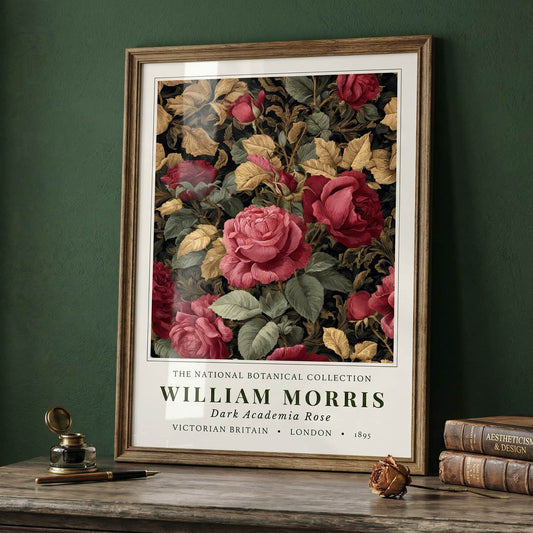 William Morris, Victorian Britain, London, Botanical Collection framed floral artwork with 'William Morris' text on a wooden table against a green wall.