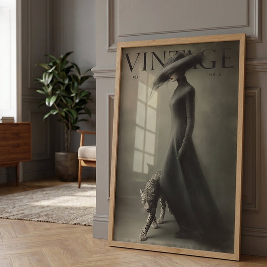 Framed vintage-style poster of a woman and leopard in a room with wooden flooring and a plant.