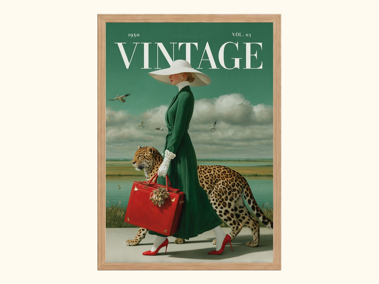 A framed vintage-style art print leaning on a windowsill, showing a woman in a green dress walking with a cheetah, with the word 'VINTAGE' across the top. The print is surrounded by a real window scene with daylight, plants, and buildings.