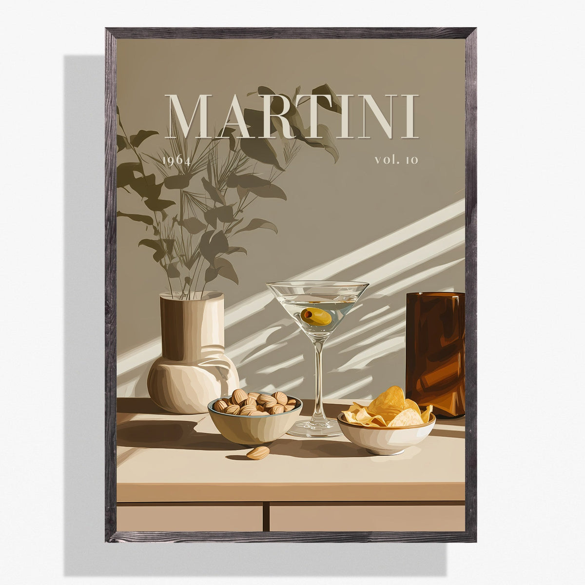 A framed art print featuring a minimalist still life illustration of a martini glass, bowls of olives and citrus, and a vase with leaves on a beige background. The word 'MARTINI' is printed at the top, and the print is shown hanging against a light gray wall.