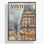 Vintoire Rainy Paris vintage magazine cover poster in a black frame, showing a pink Haussmann building and glowing café on a rainy Paris street, November 1956 issue.