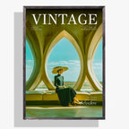 A framed vintage-style magazine cover titled VINTAGE, featuring a seated woman in a wide-brimmed hat inside an architectural interior with large arched windows. The cover is shown hanging against a light gray wall with a soft shadow.