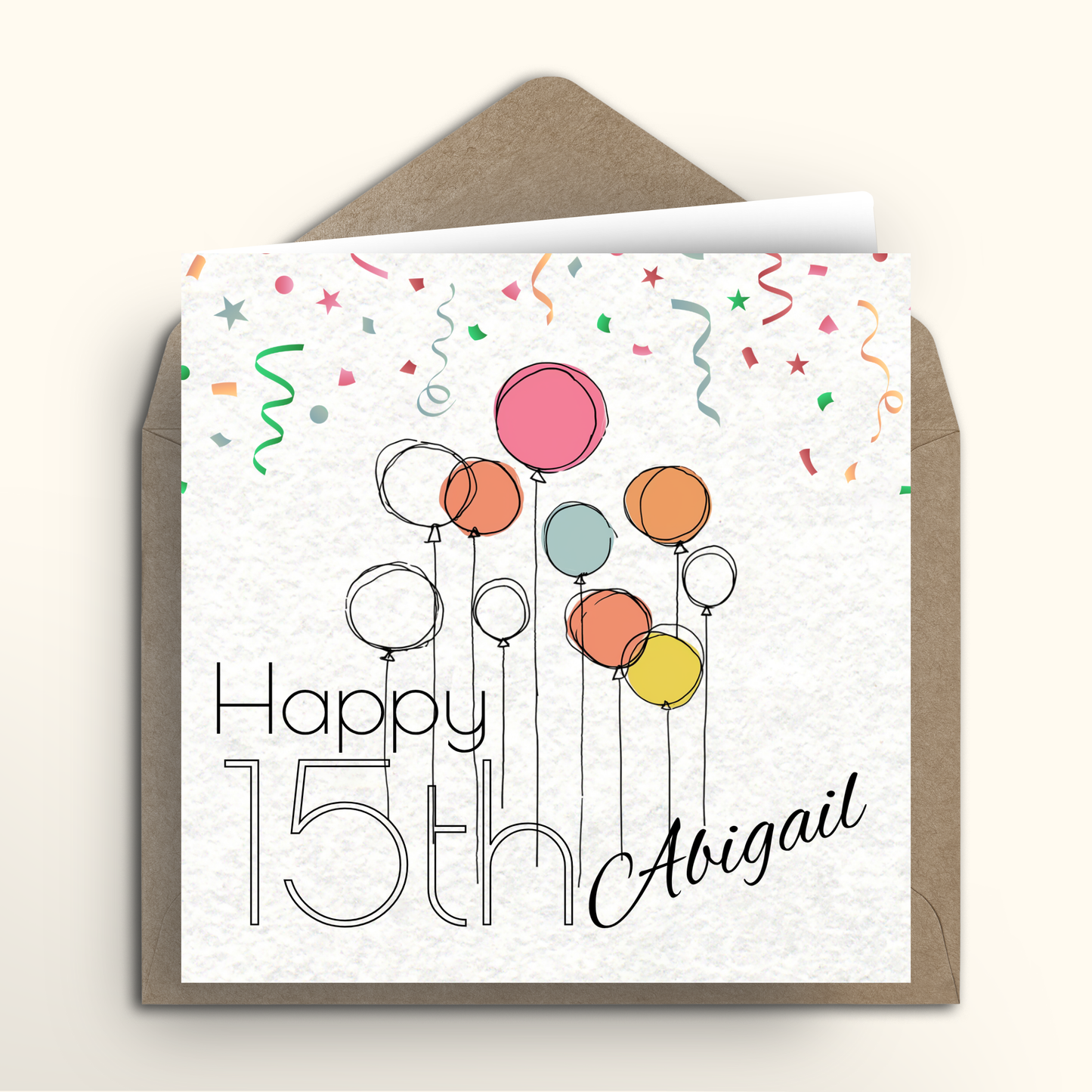 Greeting card with colorful balloons and 'Happy 15th Abigail' text on a white background with a brown envelope.