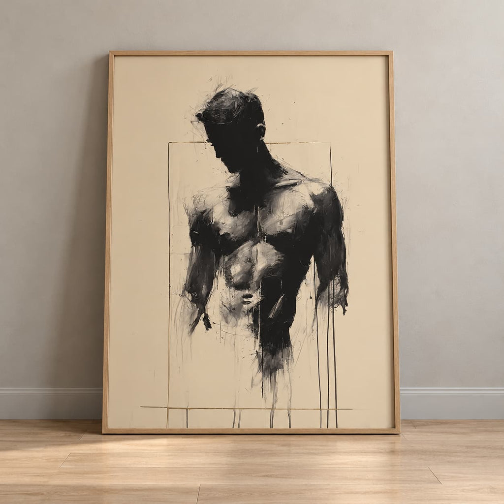 A framed vertical art print featuring a black charcoal-style sketch of a male torso on a warm cream background, leaning against a light gray wall on a light wood floor.