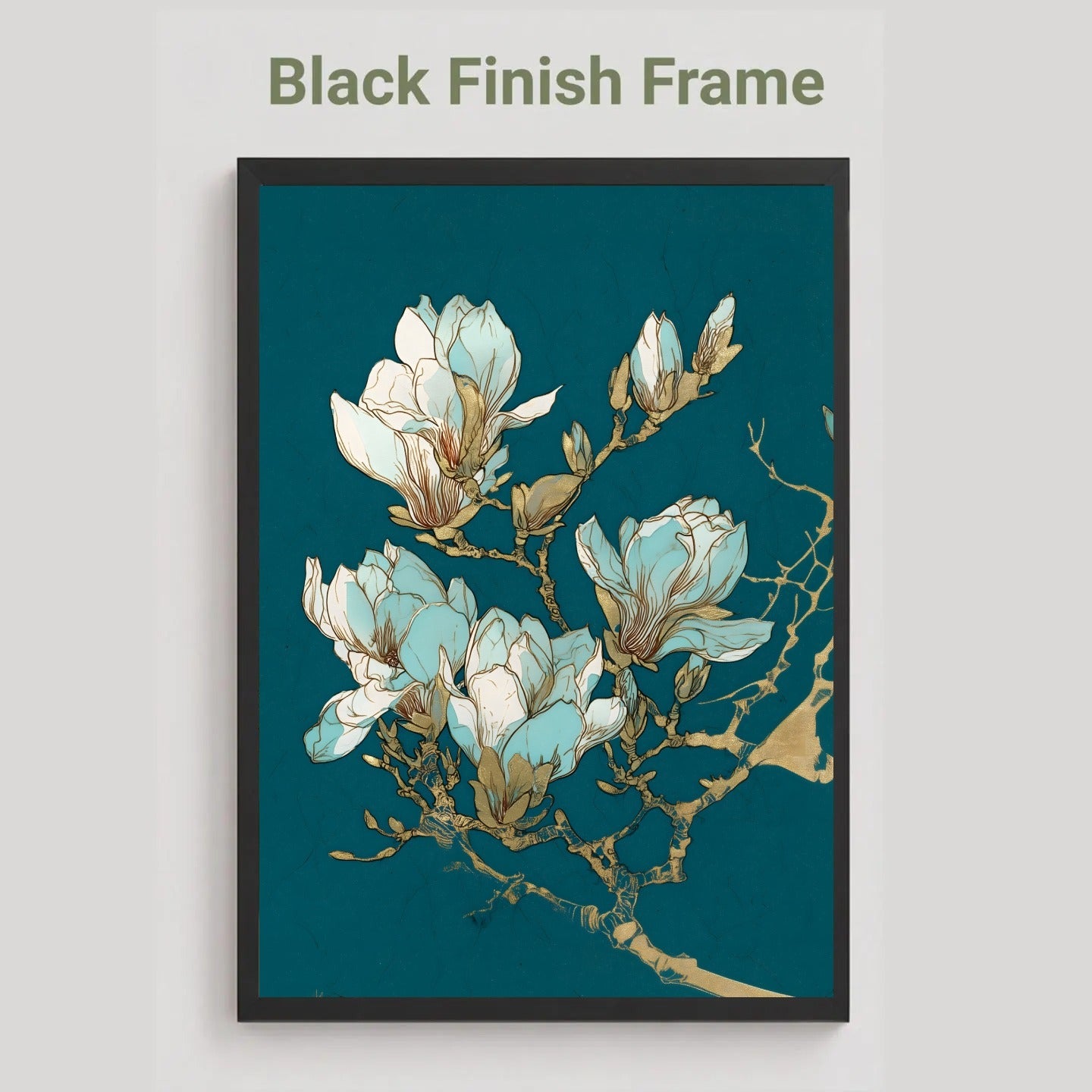A framed botanical art print featuring white and light blue magnolia blossoms with gold branch details on a deep teal background, shown with a black frame and the text 'Black Finish Frame' above it on a light gray background.