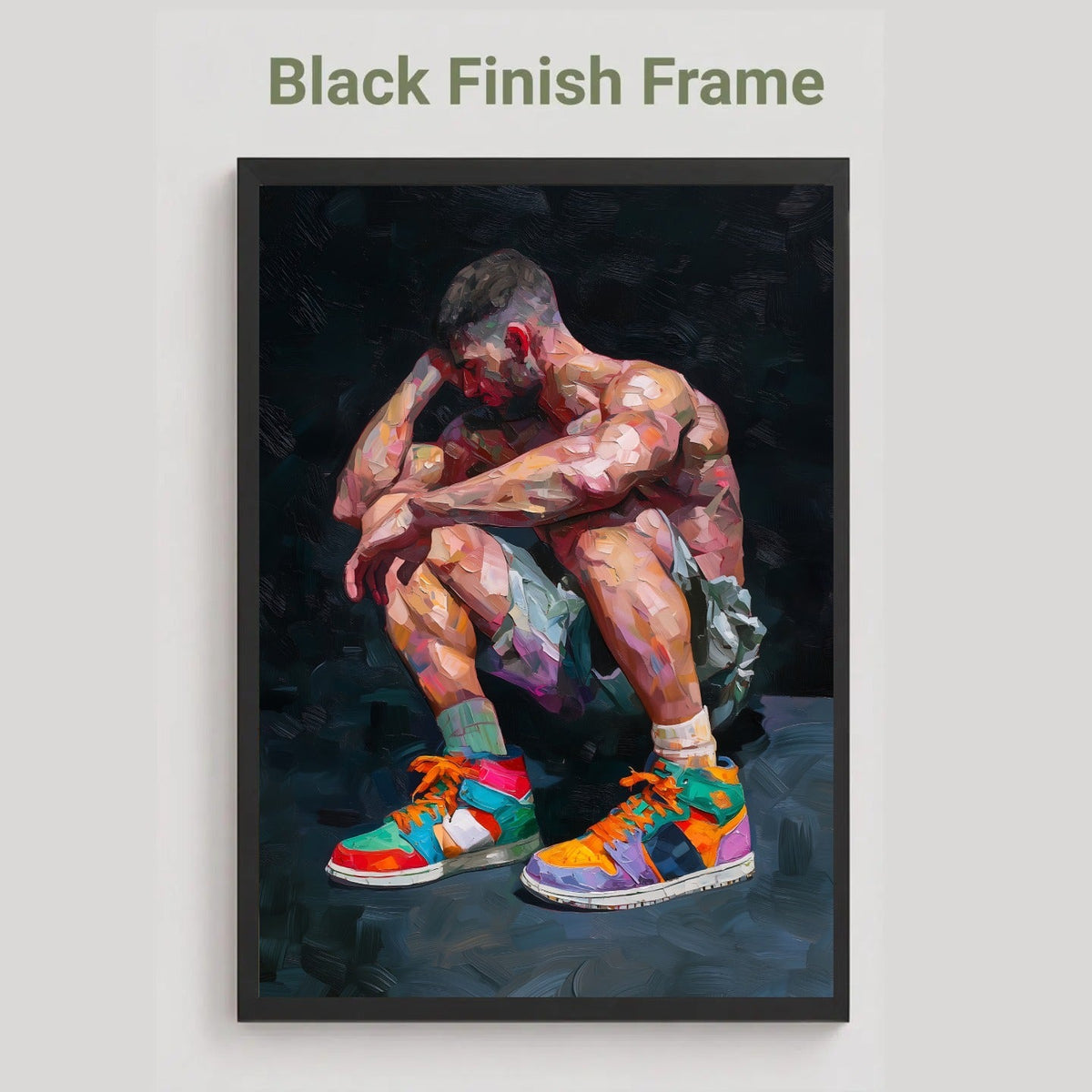 Pause gay art print in the black finish frame option, a muscular man crouching in colourful high-top trainers, labelled Black Finish Frame