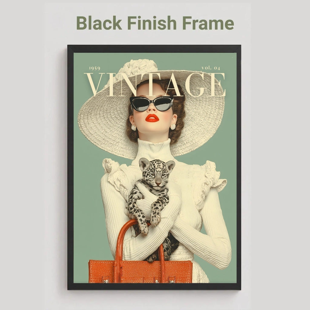 A framed vintage-style art print featuring a woman in a large hat and sunglasses holding a leopard cub, with the word 'VINTAGE' across the top. The print is shown in a black frame against a light gray background, with the text 'Black Finish Frame' above it.