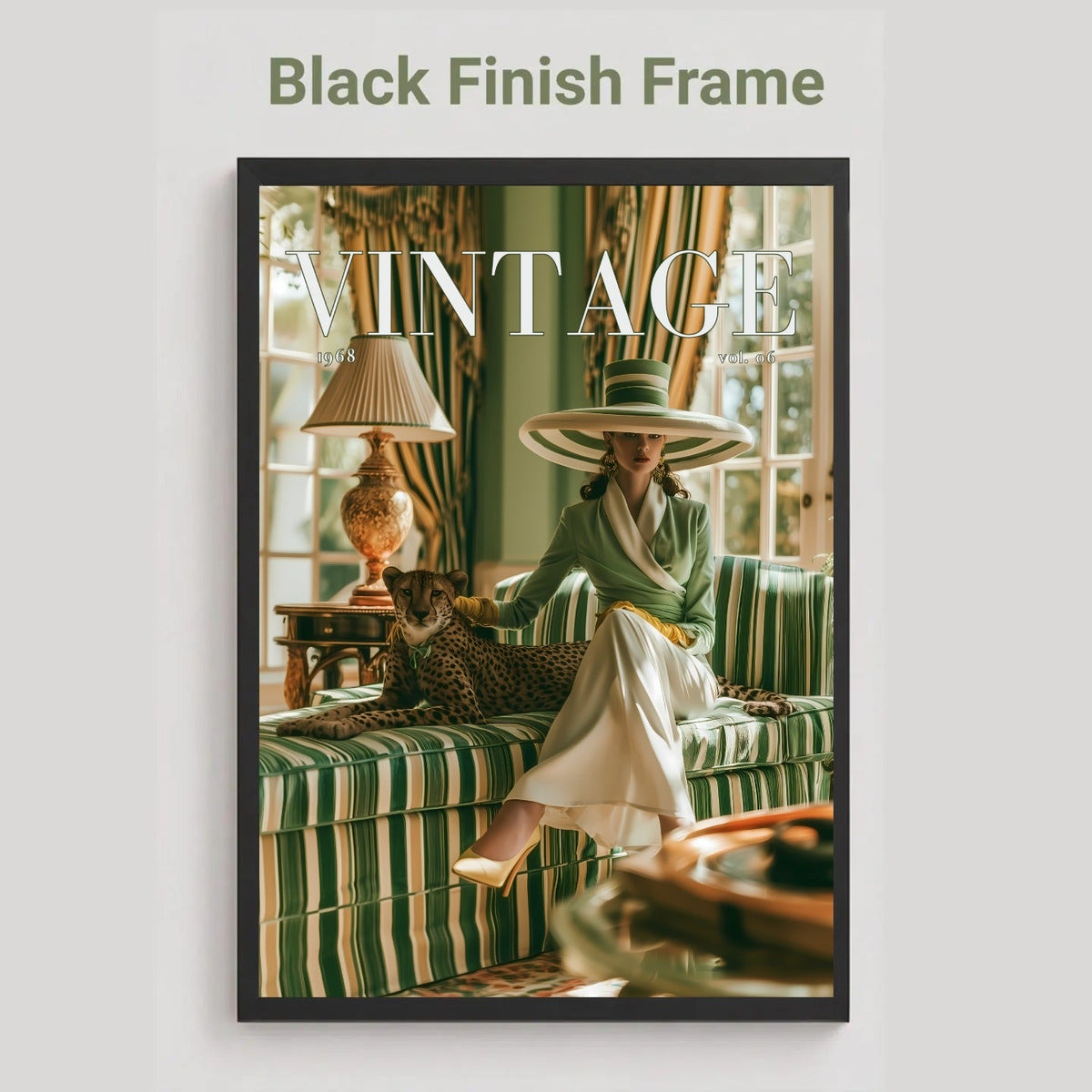 A framed art print featuring a vintage magazine cover design with the title 'VINTAGE' and a woman in a wide-brimmed hat seated on a green striped sofa with a leopard, shown against a light gray background with the text 'Black Finish Frame' above.
