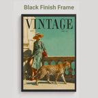 A framed vintage-style poster or magazine cover art on a light gray background, with the text 'Black Finish Frame' above it. The artwork shows a woman in a patterned dress leaning on a balcony beside a leopard, with the large word 'VINTAGE' across the top.