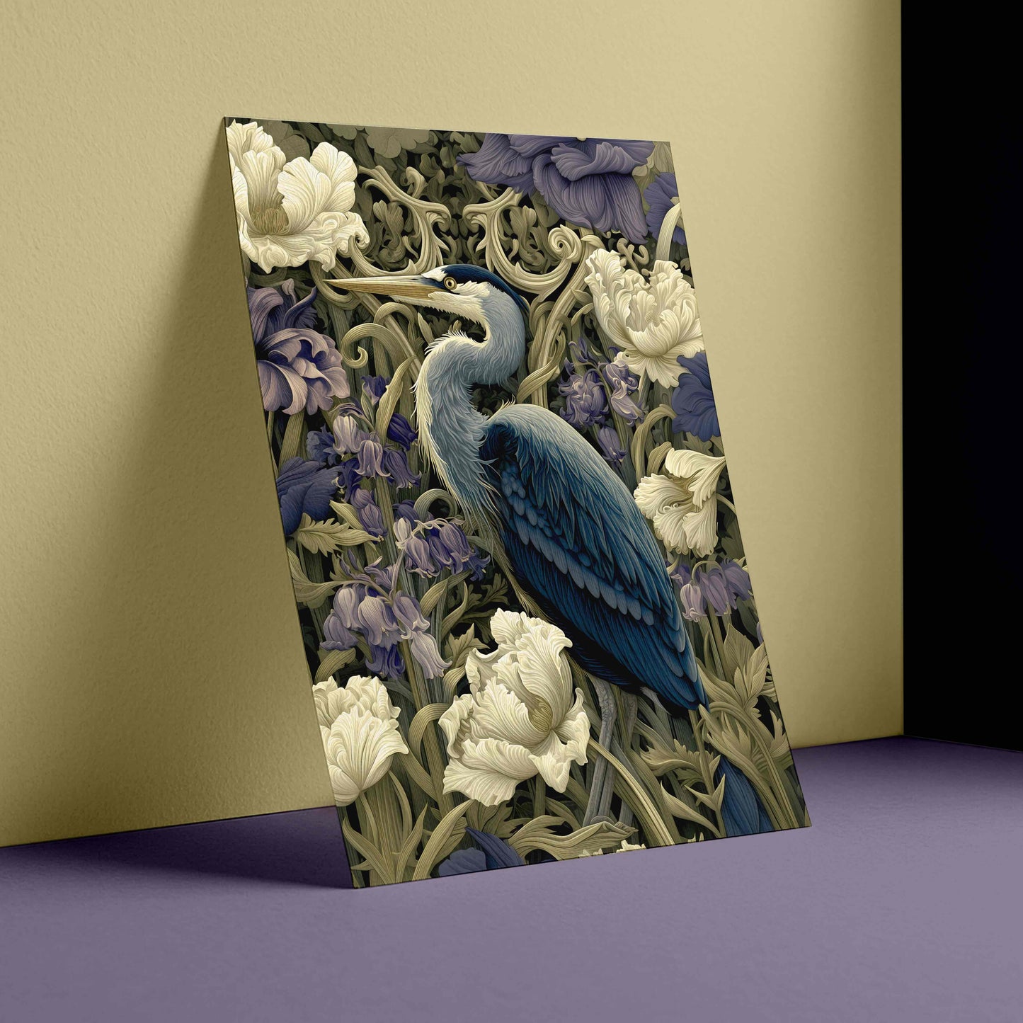 A vertical canvas print featuring a detailed illustration of a blue heron surrounded by white flowers and purple foliage, styled leaning against a beige wall on a purple floor.