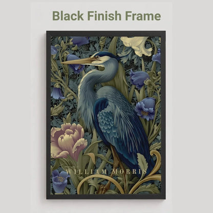 Decorative print with a blue heron and floral elements in a black frame on a light gray background. Blue heron among peonies and campanula in Victorian Arts & Crafts botanical style — dark teal, navy and olive art print