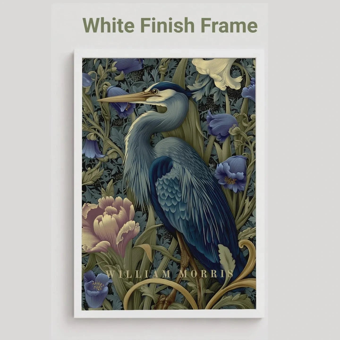 Framed artwork of a blue heron and flowers with 'White Finish Frame' text. Blue heron among peonies and campanula in Victorian Arts & Crafts botanical style — dark teal, navy and olive art print