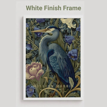 Framed artwork of a blue heron and flowers with 'White Finish Frame' text. Blue heron among peonies and campanula in Victorian Arts & Crafts botanical style — dark teal, navy and olive art print