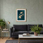 A four-panel collage showing a framed floral wall art print styled in different interior settings: above a sofa, above a sideboard, above a bookshelf, and on a round console wall mirror. The product being sold appears to be the framed print itself rather than the room decor.