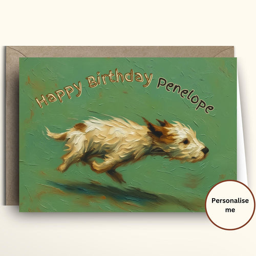 A personalized pet birthday card featuring an oil-painted style illustration of a small white and brown dog running across a textured green background, with the text 'Happy Birthday Penelope'. The card is shown with a brown kraft envelope behind it on a light cream background, with a 'Personalise me' badge overlay in the bottom right corner.