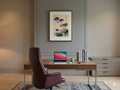 Modern home office with wooden desk, laptop, chair, and wall art.