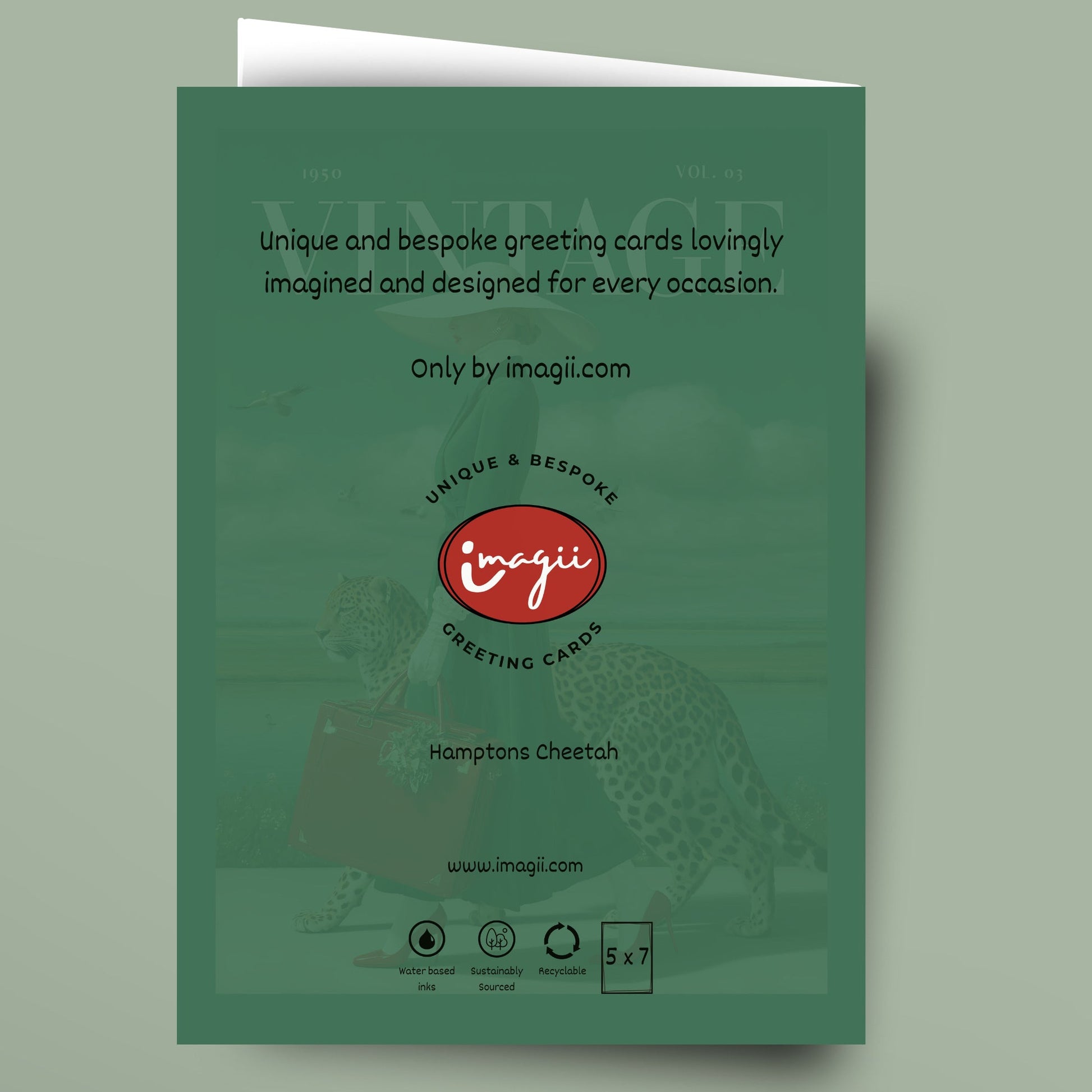 A green greeting card shown standing upright against a muted sage background. The front of the card features a faint cheetah graphic, white descriptive text, and the red oval 'imagii' logo with 'Greeting Cards' beneath it.