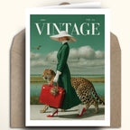 A vintage-style art print card featuring a woman in a green dress and white hat walking with a leopard and red suitcase, styled with a brown envelope behind it on a light beige background.