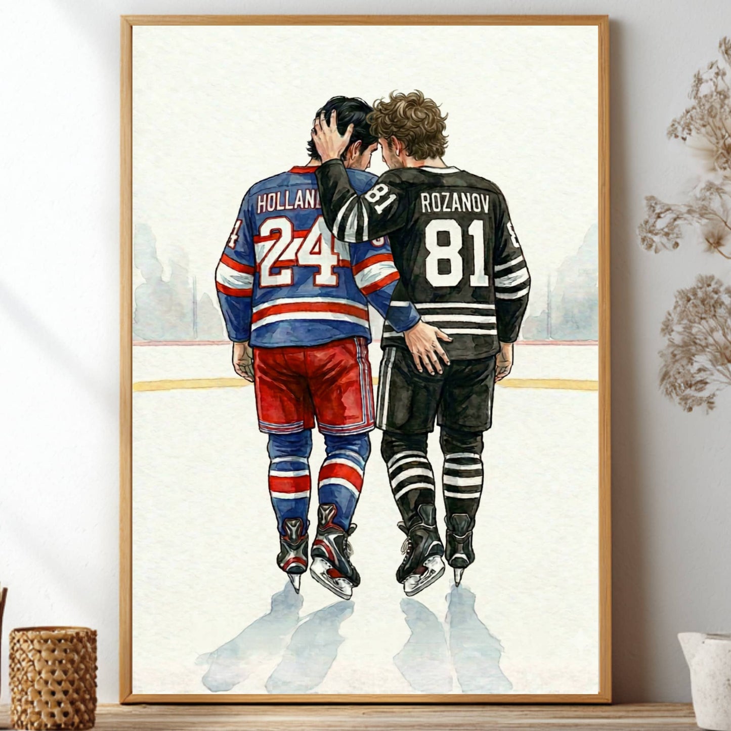 Framed artwork of two hockey players on an ice rink with a decorative plant and home decor items.