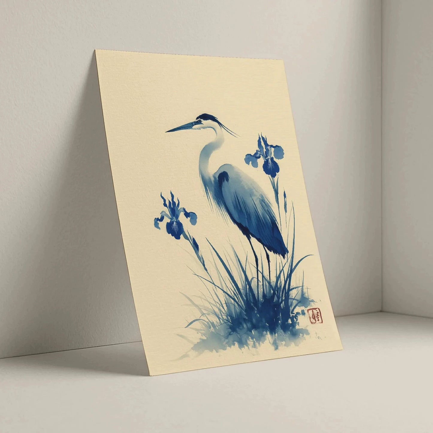 Artistic depiction of a heron and flowers on a beige background. Blue heron and water iris sumi-e print in indigo and cream — Japanese watercolour wall art with cinnabar seal
