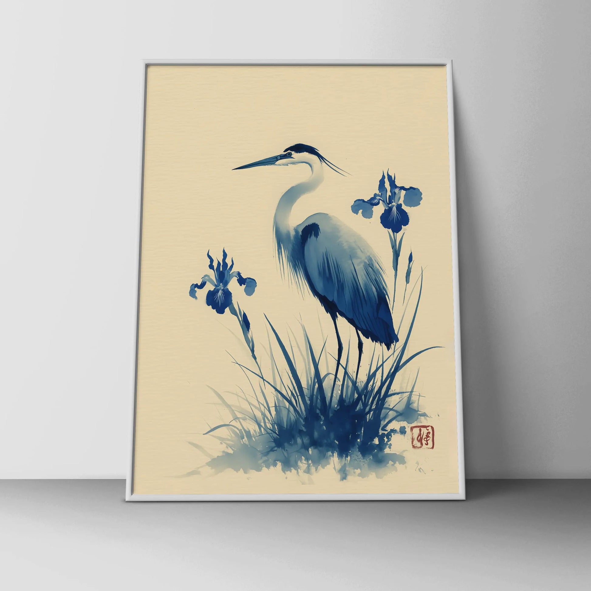Framed artwork of a blue heron and iris flowers on a beige background. Blue heron and water iris sumi-e print in indigo and cream — Japanese watercolour wall art with cinnabar seal