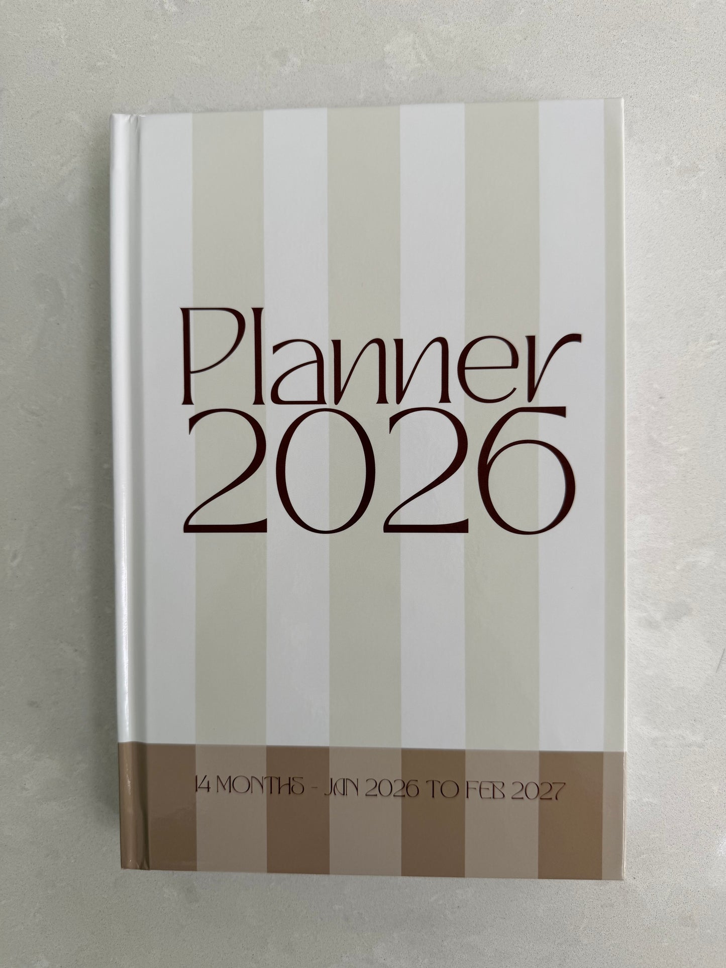Planner 2026 with striped design on a gray background