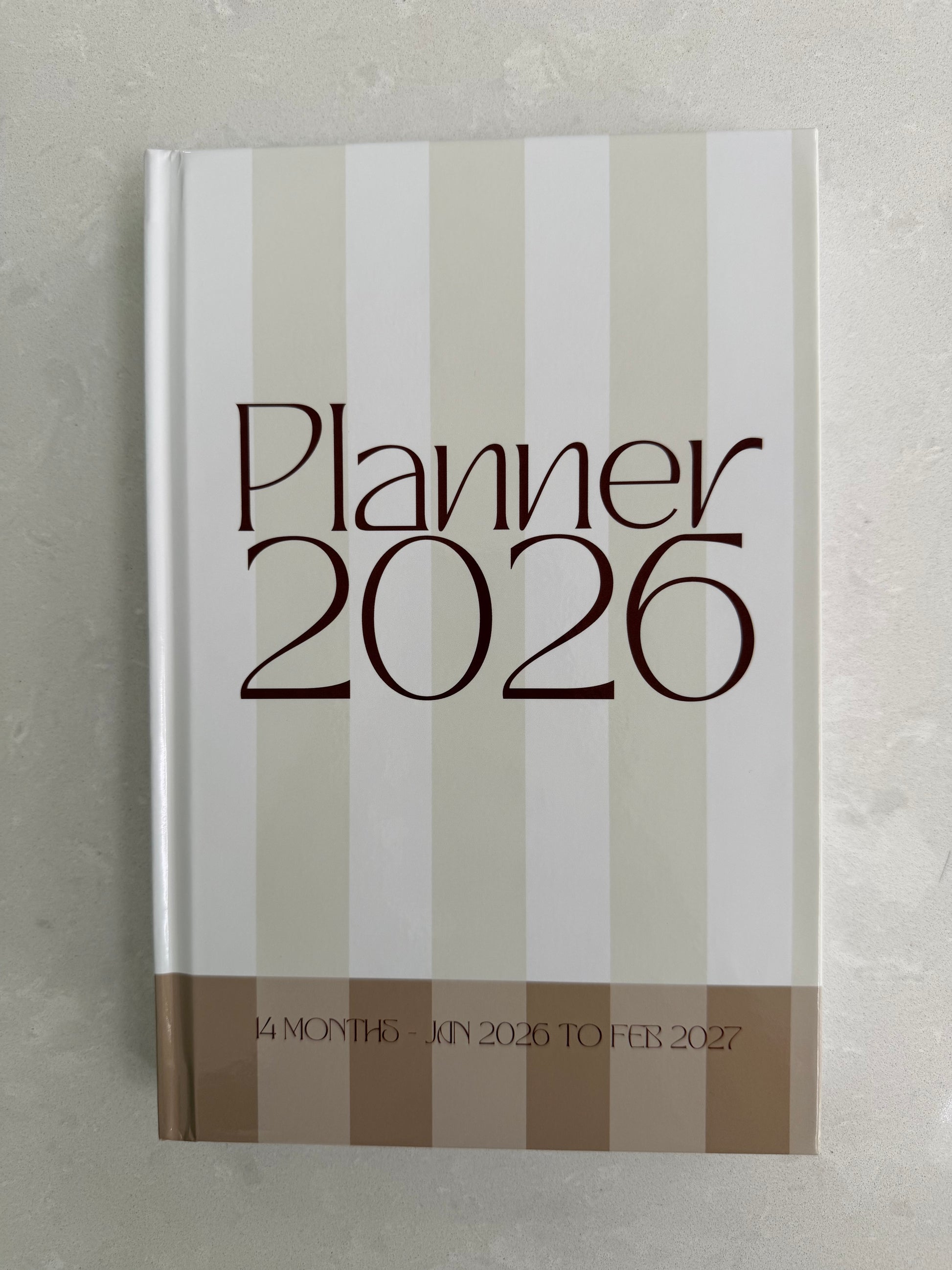 Planner 2026 with striped design on a gray background