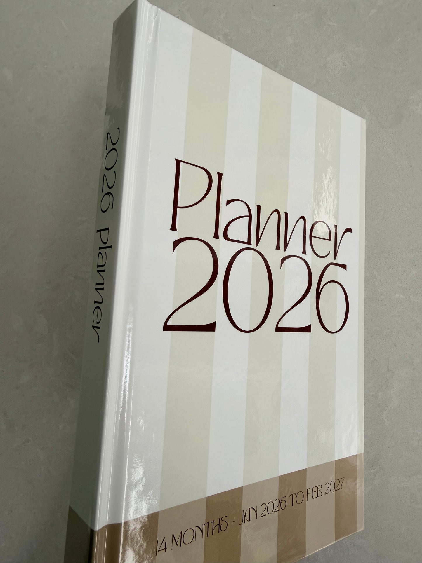Planner 2026 book with striped design on a gray background