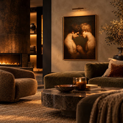 A framed classical painting depicting two embracing figures hangs on a textured wall in a warm, modern living room with dark green velvet sofas, a marble coffee table, and a fireplace in the background.