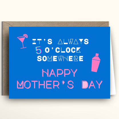 Funny Mother's Day greeting card featuring bright electric blue background with hot pink and white text reading It's Always 5 O'Clock Somewhere Happy Mother's Day, pink martini glass and cocktail shaker icons, minimalist novelty humor design, shown with kraft brown envelope