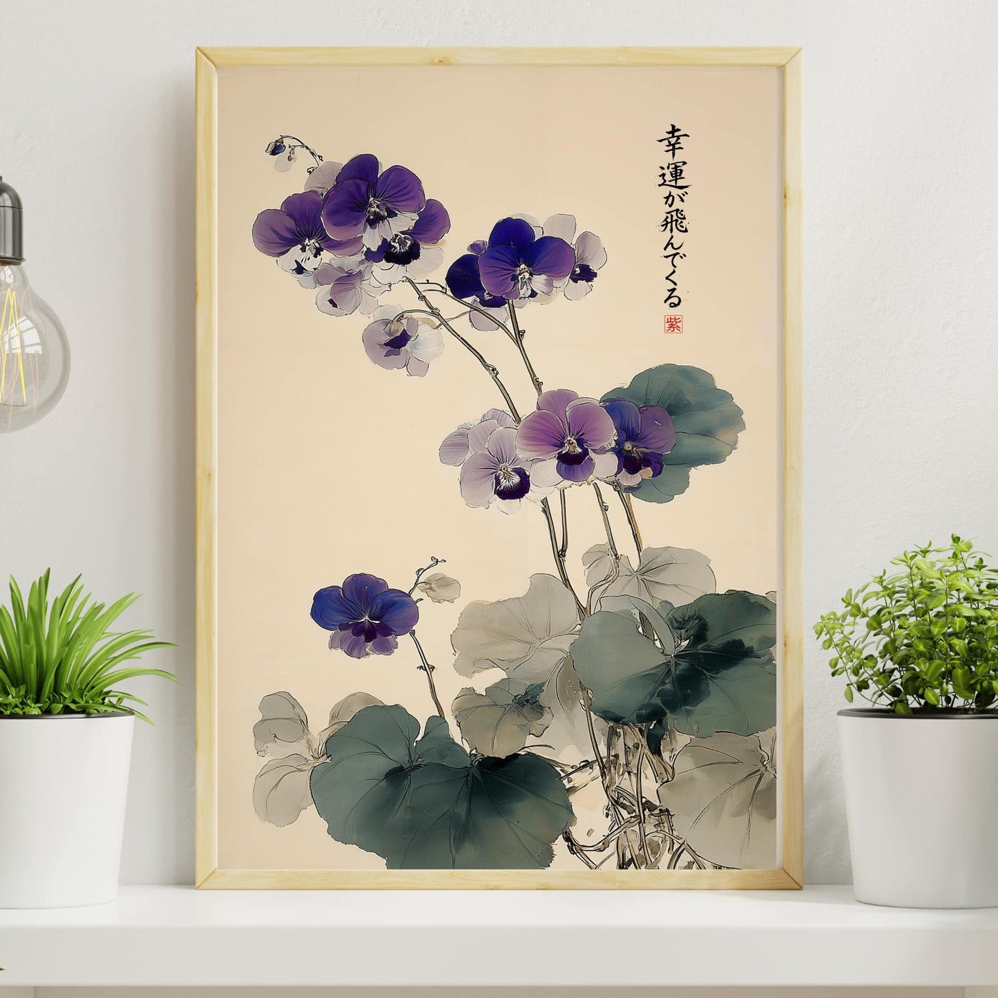 Framed artwork of purple flowers on a wall with plants and a light bulb.