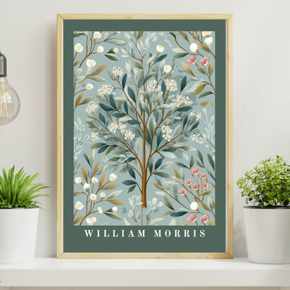 Framed artwork with botanical floral design and 'William Morris' text on a shelf with plants.