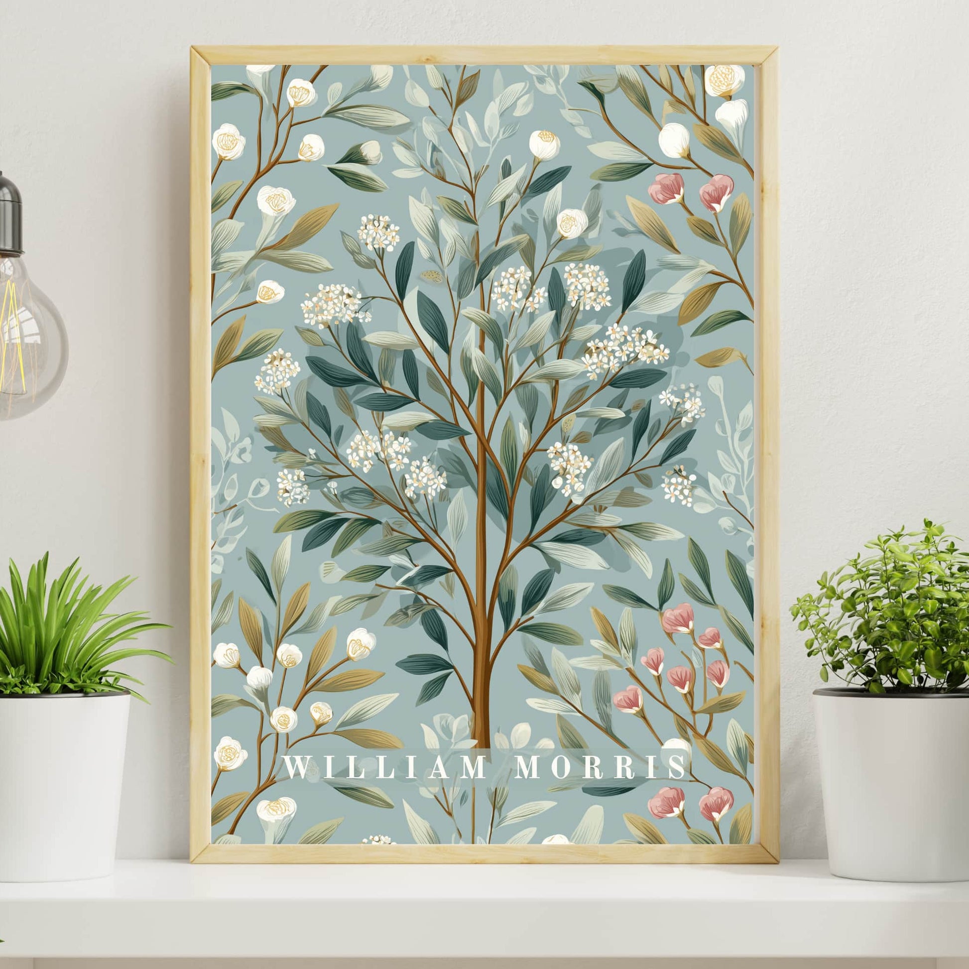 Framed botanical artwork with 'William Morris' branding on a shelf with plants.