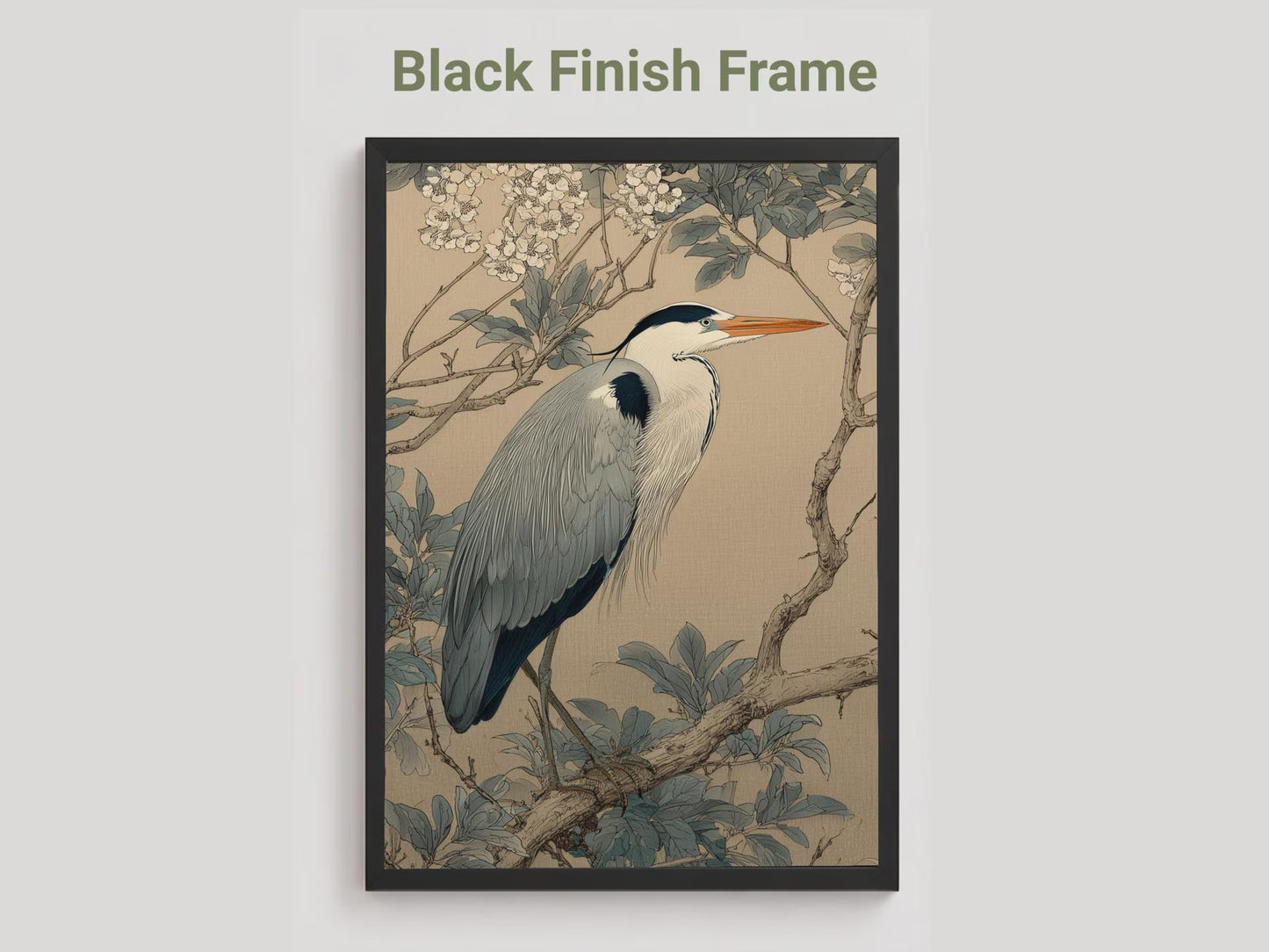 Framed artwork of a heron on a branch with leaves and flowers, black frame.