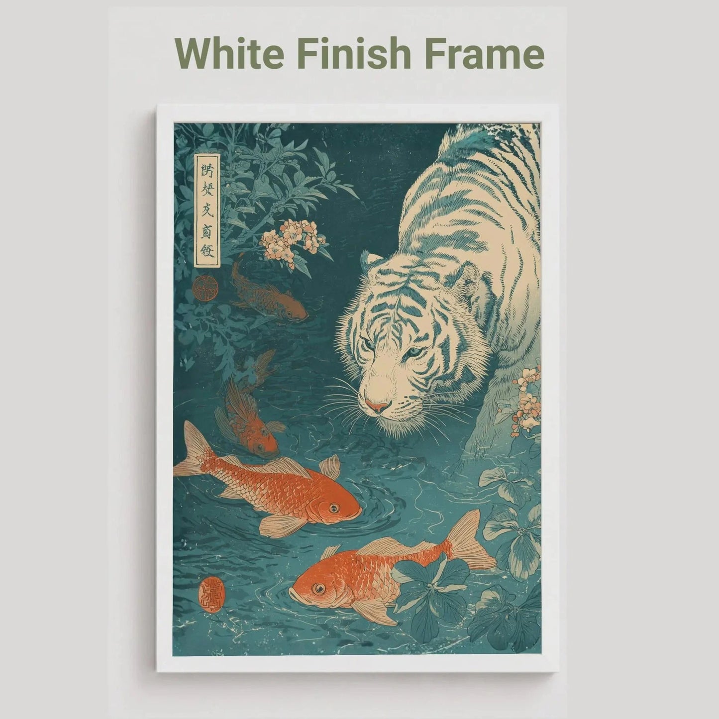Framed artwork of a tiger and goldfish with a white finish frame on a light gray background. Japanese woodblock-style art print of a white tiger gazing into a teal koi pond, with three orange koi fish swimming in the foreground, cherry blossoms, lush foliage, and traditional Japanese calligraphy seals, in a deep teal and burnt-orange palette.