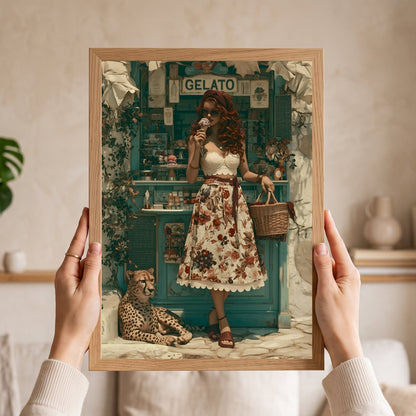 A framed art print held up by two hands in a cozy indoor setting. The print features a vintage-style illustration of a woman in a floral dress standing in front of a teal gelato shop, with a cheetah at her side. Vintage, maximalist, eclectic wall art.