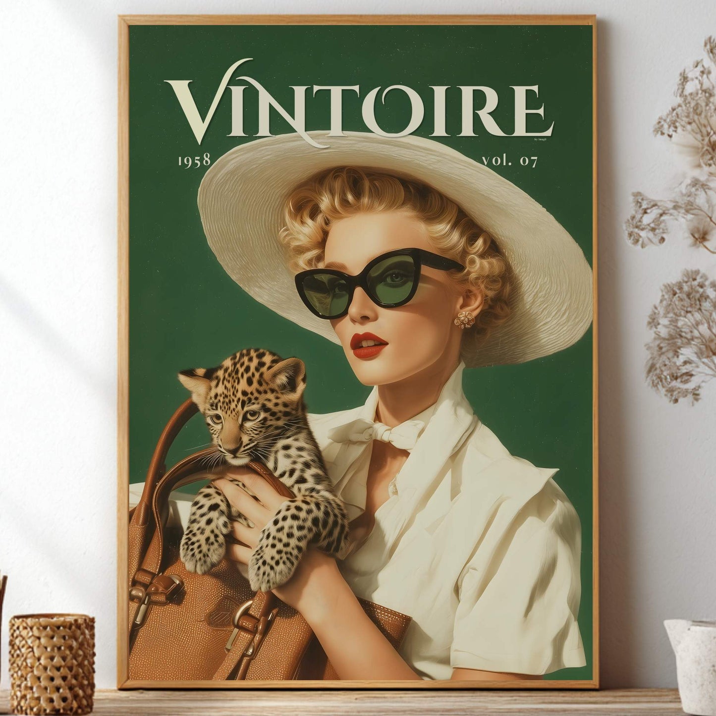 A framed vintage-style poster featuring the magazine cover 'VINTOIRE 1948 vol. 07' with a woman in a white hat and sunglasses holding a leopard, displayed on a shelf with dried flowers and decorative vases. Retro leopard wall art poster: 1950s woman in cat-eye sunglasses holding a leopard cub, green vintage print for maximalist decor