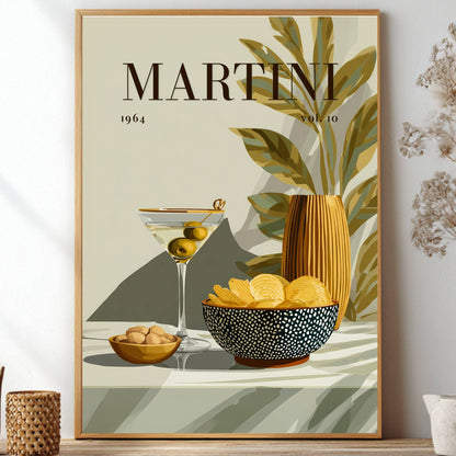 A framed vintage-style art print featuring the word 'MARTINI 1964' above a martini glass with olives, a bowl of chips, and a striped vase, styled on a shelf with dried flowers and small decor objects.