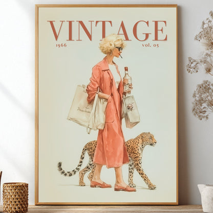 A framed vintage-style art print featuring a woman in a pink coat walking a cheetah, styled on a shelf with dried flowers and small decorative vases in a bright interior setting.