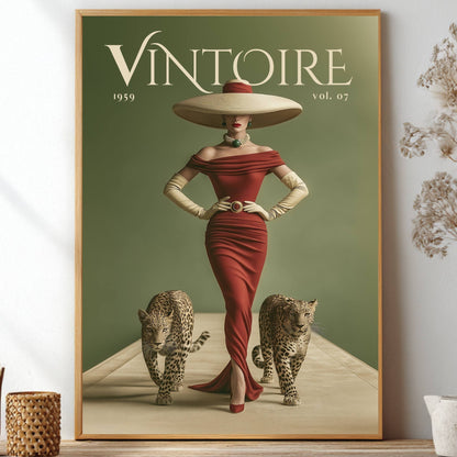 A framed vintage-style poster leaning on a shelf against a light wall, showing a woman in a red dress and large hat with two leopards beneath the title 'VINTOIRE 1959 vol. 07'.