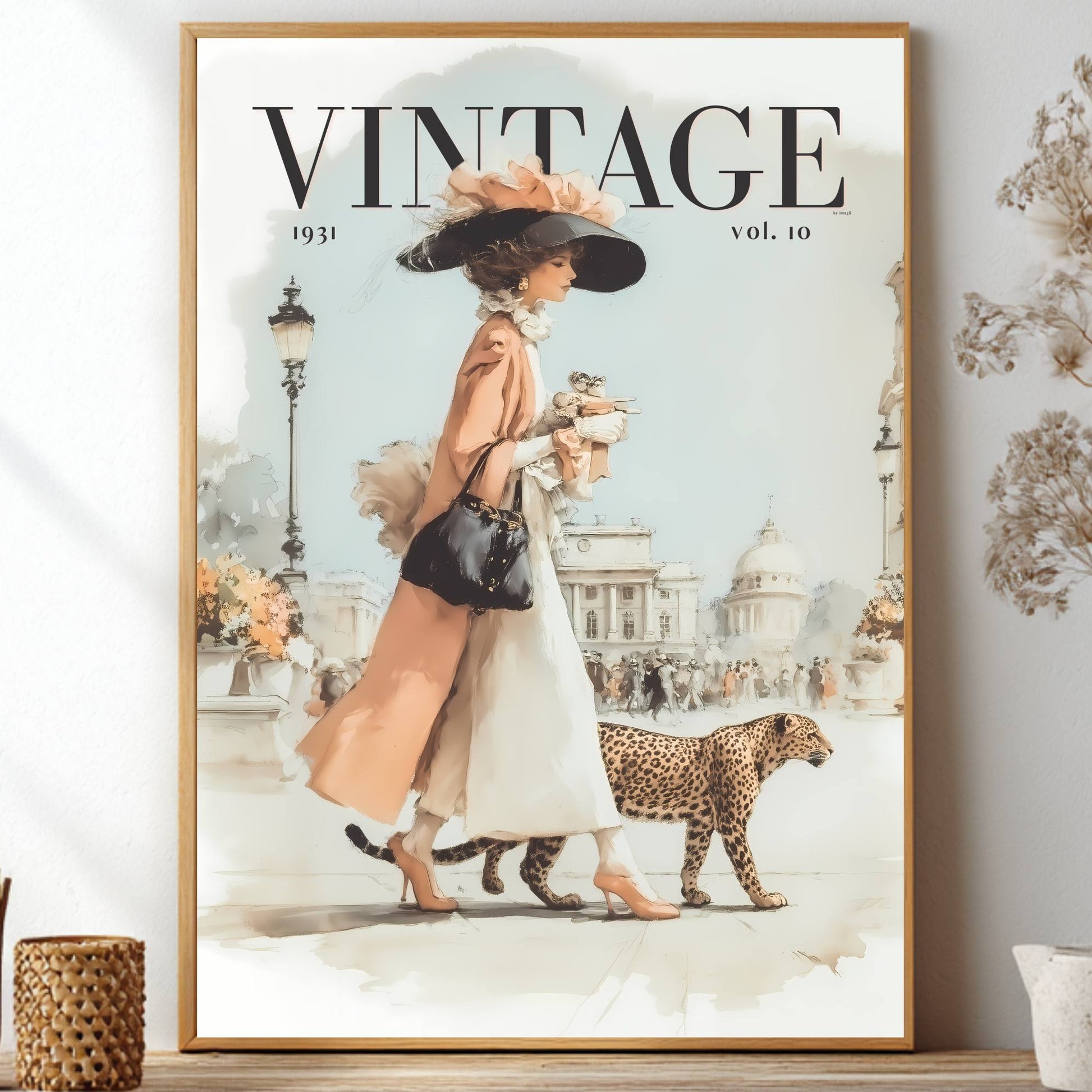 A framed vintage-style art print featuring a woman in a peach coat and white dress walking with a leopard, styled on a shelf beside dried flowers and decorative vases.