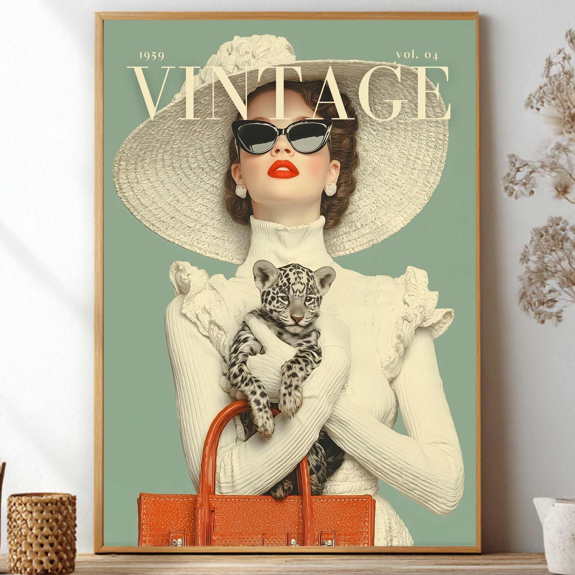 A framed vintage-style poster print displayed on a shelf in a styled interior. The poster features a woman in a large sun hat and sunglasses holding a spotted kitten, with the word VINTAGE at the top and a muted sage-green background.