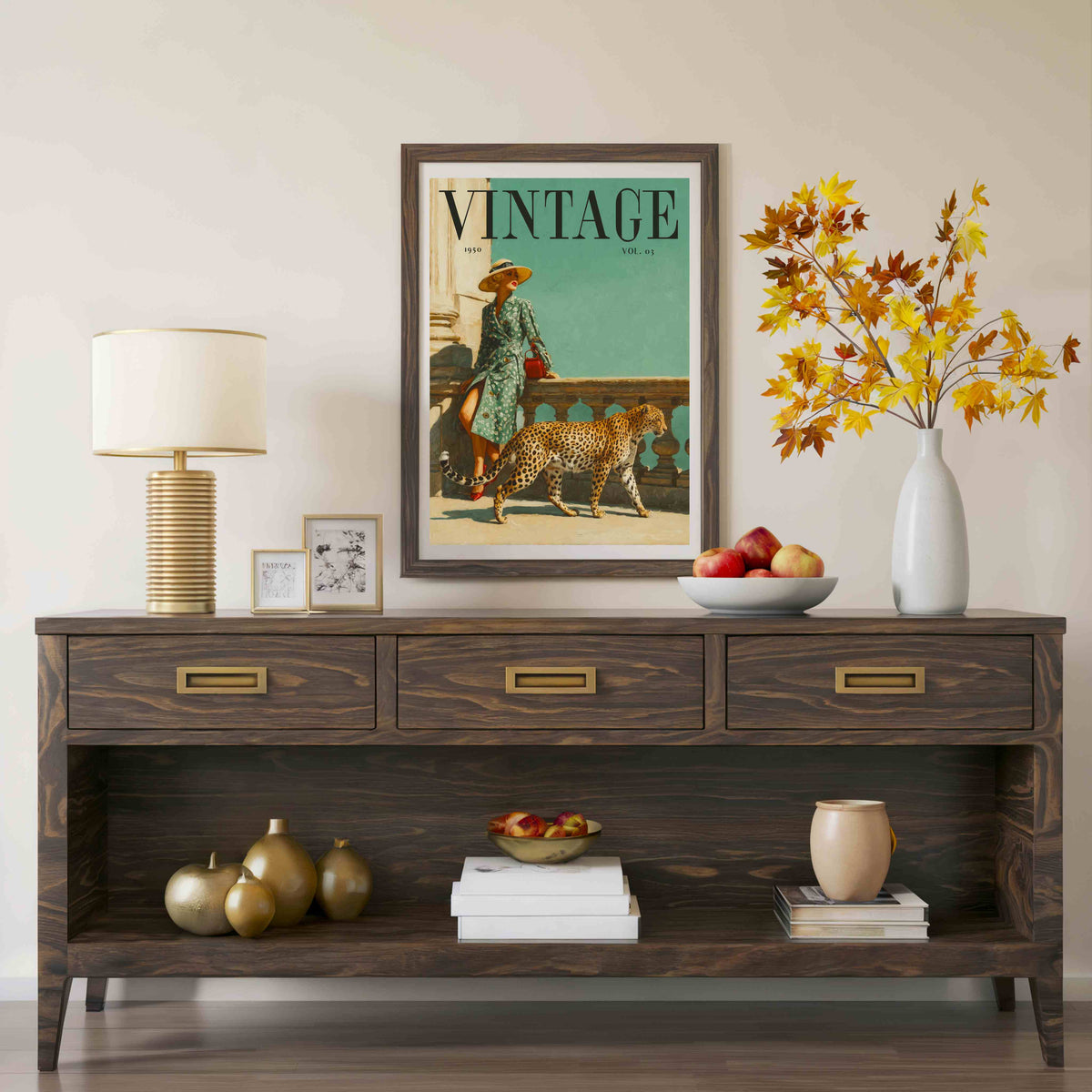 A framed vintage-style magazine cover print hangs on a beige wall above a dark wood console table. The print shows a woman walking a cheetah with the word 'VINTAGE' at the top.