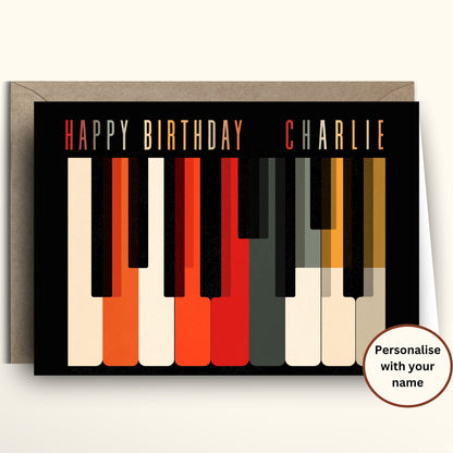 Personalized mid century modern retro piano keys birthday card with Saul Bass style graphic illustration in orange red black and cream.
