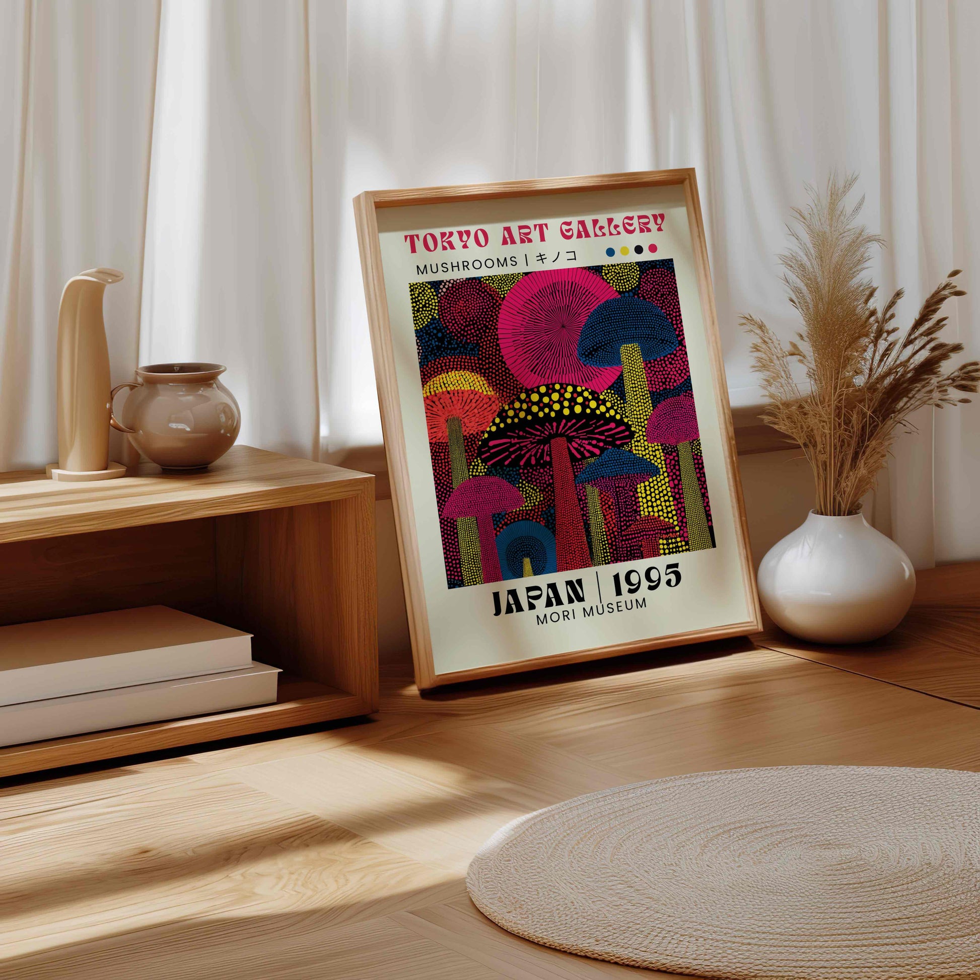 Framed artwork of neon mushrooms in dot format on a wooden surface with decorative items