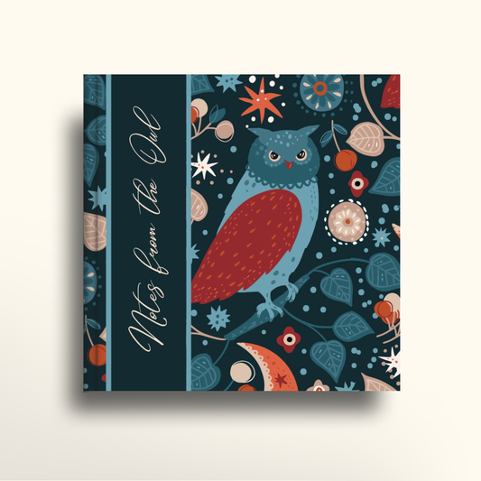 Notebook cover with an owl design and decorative elements on a dark blue background