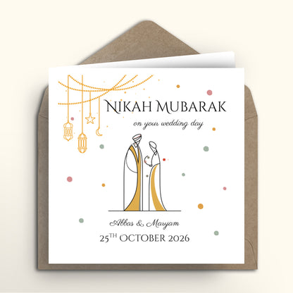 Wedding card with 'Nikah Mubarak' text and couple illustration on a white background with brown envelope.