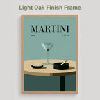 A framed art print featuring a minimalist Martini poster design, shown with a light oak wood frame on a neutral gray background. The text 'Light Oak Finish Frame' is displayed above the frame.