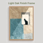 A framed wall art print with a light oak finish frame, featuring an abstract design of beige and textured blue blocks with a black cat silhouette sitting in a window-like opening. The text 'Light Oak Finish Frame' appears above the frame on a light gray background.