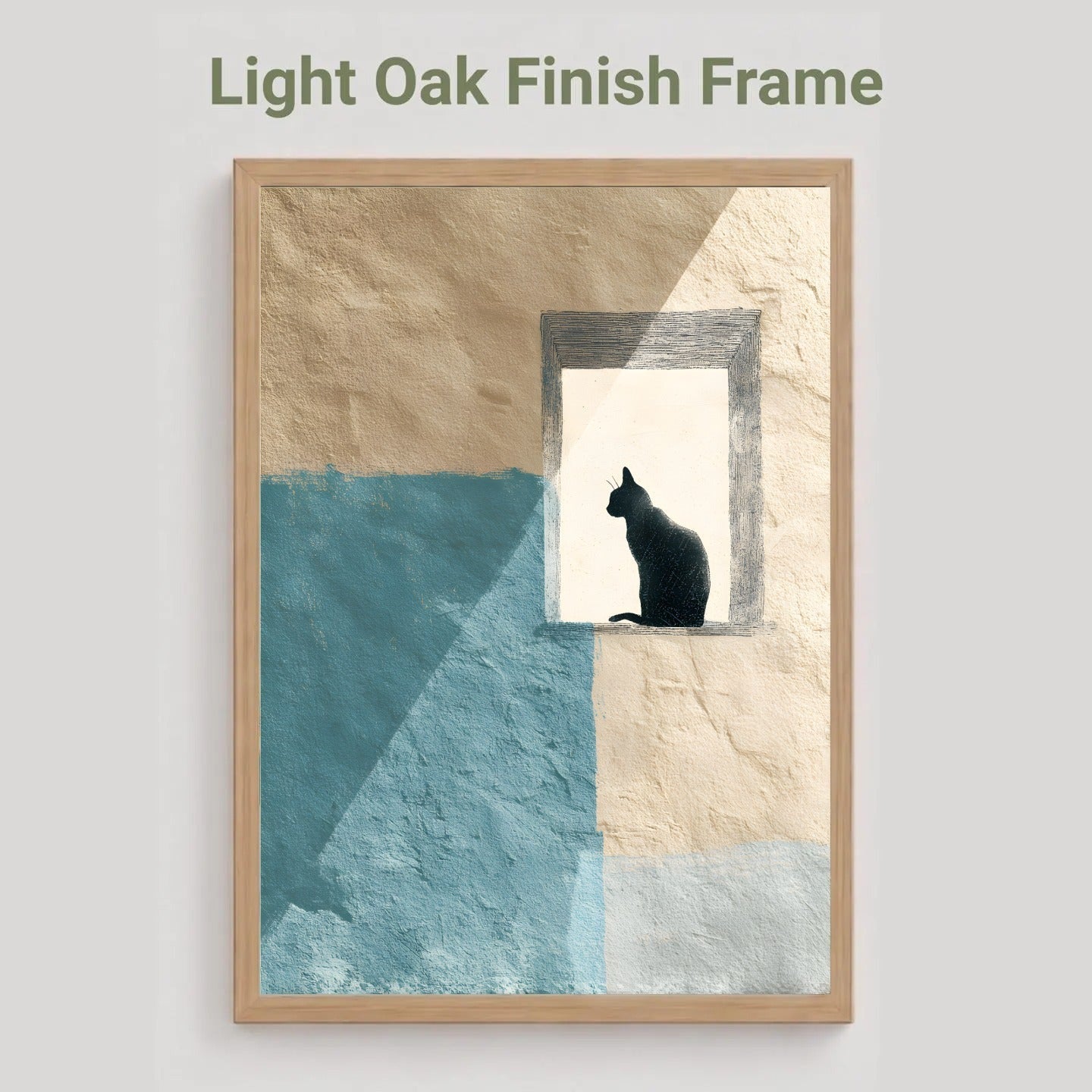 A framed wall art print with a light oak finish frame, featuring an abstract design of beige and textured blue blocks with a black cat silhouette sitting in a window-like opening. The text 'Light Oak Finish Frame' appears above the frame on a light gray background.